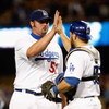 LOS ANGELES, CA - SEPTEMBER 14:  Jonathan Broxton (L) #51 of the Los Angeles Dodgers is congratulated by Russell Martin #55  after Boxton saved the game against the Pittsburgh Pirates at Dodger Stadium on September 14, 2009 in Los Angeles, California. The