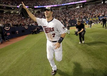 MINNEAPOLIS - OCTOBER 06:  Joe Mauer #7 of the Minnesota Twins circles the field after the Twins defeated  the Detroit Tigers to win the American League Tiebreaker game on October 6, 2009 at Hubert H. Humphrey Metrodome in Minneapolis, Minnesota.  (Photo 