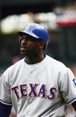SEATTLE - APRIL 13:  Left fielder Carl Everett #2 of the Texas Rangers walks to the dugout after he struck out swinging during the game against the Seattle Mariners at Safeco Field on April 13, 2003 in Seattle Washington.  The Mariners defeated the Ranger