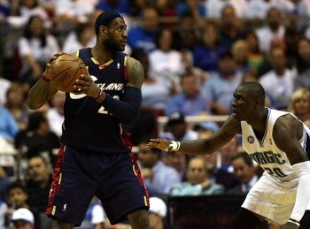 ORLANDO, FL - MAY 30:  LeBron James #23 of the Cleveland Cavaliers handles the ball against Mickael Pietrus #20 of the Orlando Magic in Game Six of the Eastern Conference Finals during the 2009 Playoffs at Amway Arena on May 30, 2009 in Orlando, Florida. 