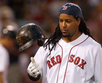 BOSTON - JULY 30: Manny Ramirez #24 of the Boston Red Sox reacts after making an out during his final at bat as a member of the Red Sox against the Los Angeles Angels of Anaheim at Fenway Park on July 30, 2008 in Boston, Massachusetts.  (Photo by Jim Roga