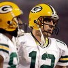 MINNEAPOLIS - OCTOBER 05:  Quarterback Aaron Rodgers #12 of the Green Bay Packers walks off the field during the Monday Night Football game against the Minnesota Vikings on October 5, 2009 at Hubert H. Humphrey Metrodome in Minneapolis, Minnesota.  (Photo