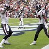 HOUSTON - OCTOBER 04:  Houston Texan Jacoby Jones #12 of the Houston Texans receives congratulations from teammate Dominique Barber #34 after his 95 yard kick return at Reliant Stadium on October 4, 2009 in Houston, Texas.  (Photo by Bob Levey/Getty Image