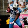 JACKSONVILLE, FL - OCTOBER 04:  Alge Crumpler #83 of the Tennessee Titans is tackled by Derek Cox #21 of the Jacksonville Jaguars at Jacksonville Municipal Stadium on October 4, 2009 in Jacksonville, Florida.  (Photo by Sam Greenwood/Getty Images)