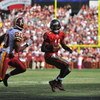 LANDOVER, MD - OCTOBER 4:  Josh Johnson #11 of the Tampa Bay Buccaneers runs the ball against the Washington Redskins at FedExField on October 4, 2009 in Landover, Maryland. The Redskins defeated the Buccaneers 16-13. (Photo by Larry French/Getty Images)