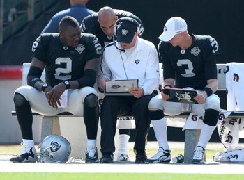 OAKLAND, CA - SEPTEMBER 27:  JaMarcus Russell #2 of the Oakland Raiders talks with a coach against the Denver Broncos on September 27, 2009 during an NFL game at the Oakland-Alameda County Coliseum in Oakland, California.  (Photo by Jed Jacobsohn/Getty Im