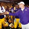 BATON ROUGE, LA - SEPTEMBER 19:  Jordan Jefferson #9 shakes hands with head coach Les Miles  of the Louisiana State University Tigers after defeating the University of Louisiana-Lafatette Ragin' Cajuns at Tiger Stadium 31-3 on September 19, 2009 in Baton 