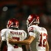 FORT LAUDERDALE, FL - OCTOBER 03: Quarterback Landry Jones #12 of the Oklahoma Sooners congratulates congratulates running back DeMarco Murray #7 after Murray's touchdown run in the third quarter against the Miami Hurricanes at Land Shark Stadium on Octob