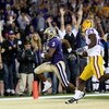 SEATTLE - SEPTEMBER 05:  Wide receiver James Johnson #3 of the Washington Huskies scores a touchdown past Harry Coleman #24 of the LSU Tigers on September 5, 2009 at Husky Stadium in Seattle, Washington. (Photo by Otto Greule Jr/Getty Images)