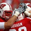 MADISON, WI - SEPTEMBER 26: Garrett Graham #89 of the Wisconsin Badgers is congratulated by teammates after catching his third touchdown pass against the Michigan State Spartans on September 26, 2009 at Camp Randall Stadium in Madison, Wisconsin. Wisconsi