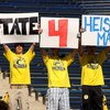 ANN ARBOR, MI - SEPTEMBER 19:  Fans of quarterback Tate Forcier #5 of the Michigan Wolverines hold signs promoting him before the game against the Eastern Michigan Eagles at Michigan Stadium on September 19, 2009 in Ann Arbor, Michigan.   Michigan won 45-