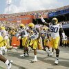 GAINESVILLE, FL - OCTOBER 7:   Charles Alexander #91, Chris Hawkins #29 and Ricky Jean-Francois #90 of the LSU Tigers run onto the field before the game against the Florida Gators at Ben Hill Griffin Stadium on October 7, 2006 in Gainesville, Florida. Flo