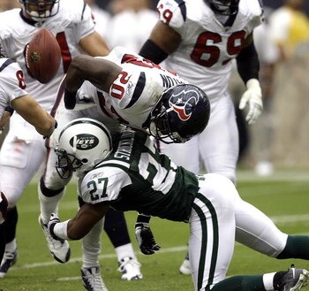 HOUSTON - SEPTEMBER 13: Running back Steve Slaton #20 of the Houston Texans fumbles the ball as he is hit by cornerback Donald Strickland #27 of the New York Jets at Reliant Stadium on September 13, 2009 in Houston, Texas.  (Photo by Bob Levey/Getty Image
