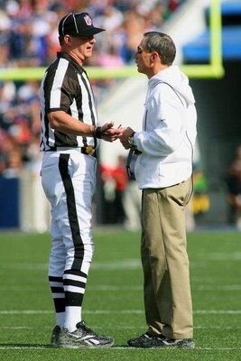 ORCHARD PARK, NY - SEPTEMBER 20:  Head Coach Dick Jauron of the Buffalo Bills talks with an official during a break from the game against the Tampa Bay Buccaneers at Ralph Wilson Stadium on September 20, 2009 in Orchard Park, New York.  The Bills won 33-2