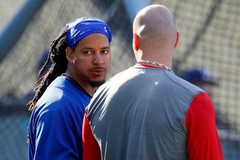 LOS ANGELES, CA - OCTOBER 07:  Manny Ramirez #99 of the Los Angeles Dodgers talks with Albert Pujols #5 of the St. Louis Cardinals before Game One of the NLDS during the 2009 MLB Playoffs at Dodger Stadium on October 7, 2009 in Los Angeles, California.  (