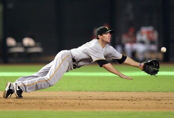 PHOENIX - JULY 26:  Infielder Andy LaRoche #15 of the Pittsburgh Pirates dives while attempting to field a single hit by the Arizona Diamondbacks during the major league baseball game at Chase Field on July 26, 2009 in Phoenix, Arizona. The Diamondbacks d