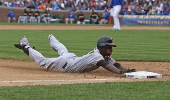 CHICAGO - MAY 27: Nyjer Morgan #3 of the Pittsburgh Pirates slides safely into third base on a 2-base error by Alfonso Soriano of the Chicago Cubs on May 27, 2009 at Wrigley Field in Chicago, Illinois. The Cubs defeated the Pirates 5-2. (Photo by Jonathan