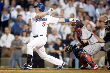 LOS ANGELES, CA - OCTOBER 08:  Mark Loretta #5 of the Los Angeles Dodgers hits a walk-off RBI single to center to score Casey Blake #23 to defeat the St. Louis Cardinals in Game Two of the NLDS during the 2009 MLB Playoffs at Dodger Stadium on October 8, 
