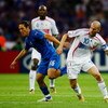 BERLIN - JULY 09:  Mauro Camoranesi of Italy (L) holds off Zinedine Zidane of France during the FIFA World Cup Germany 2006 Final match between Italy and France at the Olympic Stadium on July 9, 2006 in Berlin, Germany.  (Photo by Shaun Botterill/Getty Im