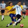 BEIJING - AUGUST 19:  Javier Mascherano of Argentina is tackled by Lucas of Brazil during the men's football semifinal match at Workers' Stadium on Day 11 of the Beijing 2008 Olympic Games on August 19, 2008 in Beijing, China.  (Photo by Shaun Botterill/G