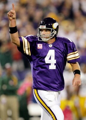 MINNEAPOLIS - OCTOBER 05:  Quarterback Brett Favre #4 of the Minnesota Vikings celebrates after a touchdown during the game against the Green Bay Packers on October 5, 2009 at Hubert H. Humphrey Metrodome in Minneapolis, Minnesota.  (Photo by Jamie Squire