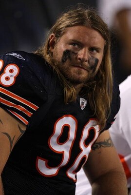 CHICAGO - AUGUST 21: Dusty Dvoracek #98 of the Chicago Bears looks at the replay board during a game against the San Francisco 49ers on August 21, 2008 at Soldier Field in Chicago, Illinois. The 49ers defeated the Bears 37-30. (Photo by Jonathan Daniel/Ge