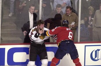 13 Feb 2002: Bob Probert #24 of the Chicago Blackhawks and Peter Worrell #8 of the Florida Panthers exchange punches during the game at United Center in Chicago , Illinois. The Blackhawks won 5-4. DIGITAL IMAGE. Mandatory Credit : Jonathan Daniel/Getty Im