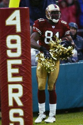 SAN FRANCISCO  - DECEMBER 15:  Terrell Owens #81 of the San Francisco 49ers uses the cherrleaders' pom poms to celebrate his touchdown catch during the game against the Green Bay Packers on December 15, 2002  at 3Com Park in San Francisco, California.  Th