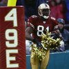 SAN FRANCISCO  - DECEMBER 15:  Terrell Owens #81 of the San Francisco 49ers uses the cherrleaders' pom poms to celebrate his touchdown catch during the game against the Green Bay Packers on December 15, 2002  at 3Com Park in San Francisco, California.  Th