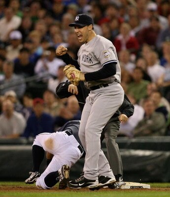 SEATTLE - SEPTEMBER 18:  Mark Teixeira #25 of the New York Yankees reacts after Ichiro Suzuki #51 of the Seattle Mariners was tagged out at first base on a pick off play on September 18, 2009 at Safeco Field in Seattle, Washington. (Photo by Otto Greule J