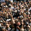OAKLAND, CA - SEPTEMBER 27:  Oakland Raiders fans cheer for their team before their game against the Denver Broncos at the Oakland-Alameda County Coliseum on September 27, 2009 in Oakland, California.  (Photo by Ezra Shaw/Getty Images)
