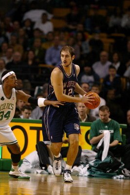 BOSTON - NOVEMBER 29:  Nenad Krstic #12 of the New Jersey Nets is defended by Paul Pierce #34 of the Boston Celtics on November 29, 2006 at the TD Banknorth Garden in Boston, Massachusetts. The Nets defeated the Celtics, 106-103. NOTE TO USER: User expres