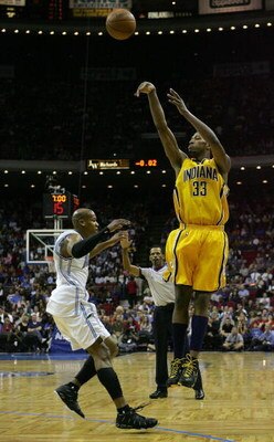 ORLANDO, FL - DECEMBER 07:  Danny Granger #33 of the Indiana Pacers shoots over Maurice Evans #1 of the Orlando Magic at Amway Arena on December 7, 2007 in Orlando, Florida. NOTE TO USER: User expressly acknowledges and agrees that, by downloading and or 