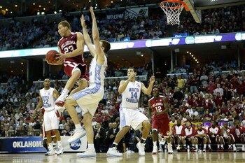 MEMPHIS, TN - MARCH 29:  Blake Griffin #23 of the Oklahoma Sooners jumps into Tyler Hansbrough #50 of the North Carolina Tar Heels in the second half during the NCAA Men's Basketball Tournament South Regional Final at the FedExForum on March 29, 2009 in M