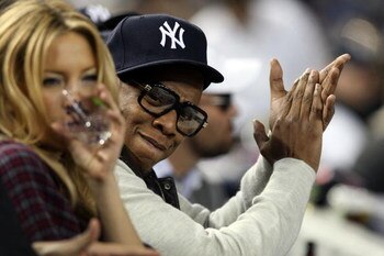 NEW YORK - OCTOBER 07:  Actress Kate Hudson and rapper Jay-Z look on from the stands before Game One of the ALDS between the Minnesota Twins and the New York Yankees during the 2009 MLB Playoffs at Yankee Stadium on October 7, 2009 in the Bronx borough of