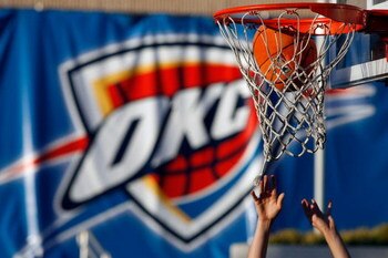 OKLAHOMA CITY - OCTOBER 29:  A fan plays basketball outside before the Milwaukee Bucks play the Oklahoma City Thunder at the Ford Center on October 29, 2008 in Oklahoma City, Oklahoma. NOTE TO USER: User expressly acknowledges and agrees that, by download