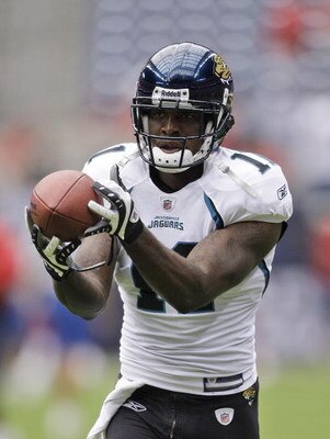 HOUSTON - SEPTEMBER 27:  Wide receiver Mike Sims-Walker #18 of the Houston Texans catches the ball during the game against the Jacksonville Jaguars at Reliant Stadium on September 27, 2009 in Houston, Texas.  (Photo by Bob Levey/Getty Images)
