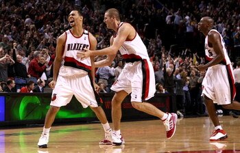 PORTLAND, OR - NOVEMBER 06:  Brandon Roy #7 of the Portland Trail Blazers celebrates with Joel Przybilla #10  after making a go ahead shot with 1.9 seconds remaining in overtime agianst the Houston Rockets  at the Rose Garden on November 6, 2008 in Portla