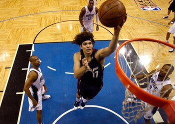 ORLANDO, FL - MAY 30:  Anderson Varejao #17 of the Cleveland Cavaliers drives to the hoop against Rafer Alston #1 and Rashard Lewis #9 of the Orlando Magic in Game Six of the Eastern Conference Finals during the 2009 Playoffs at Amway Arena on May 30, 200