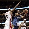 CLEVELAND - APRIL 25:  Gilbert Arenas #0 of the Washington Wizards tries to split the defense of LeBron James #23 and Flip Murray #2 of the Cleveland Cavaliers in game two of the Eastern Conference Quarterfinals during the 2006 NBA Playoffs at Quicken Loa