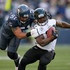 SEATTLE - OCTOBER 11:  Running back Maurice Jones-Drew #32 of the Jacksonville Jaguars is tackled by Lofa Tatupu #51 of the Seattle Seahawks on October 11, 2009 at Qwest Field in Seattle, Washington. The Seahawks defeated the Jaguars 41-0. (Photo by Otto 