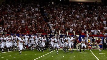 ATLANTA - SEPTEMBER 05:  Head coach Nick Saban (R) of the Alabama Crimson Tide leads his team on the field to face the Virginia Tech Hokies during the Chick-fil-A Kickoff Game at Georgia Dome on September 5, 2009 in Atlanta, Georgia.  (Photo by Kevin C. C