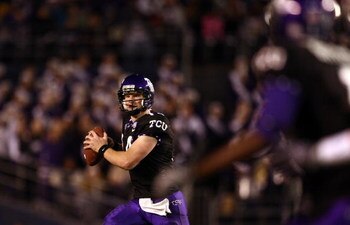 SAN DIEGO, CA - DECEMBER 23:  Quarterback Andy Dalton #14 of  TCU throws the ball against Boise State during the San Diego County Credit Union Poinsettia Bowl at Qualcomm Stadium on December 23, 2008 in San Diego, California. (Photo by Donald Miralle/Gett