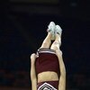 NEW ORLEANS - MARCH 15:  A Mississippi State cheerleader is flipped into the air during semifinal action in the SEC Men's Basketball Tournament against Louisiana State Univerity at the Louisiana Superdome on March 15, 2003 in New Orleans, Louisiana. Missi