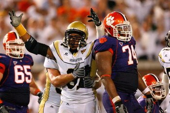 ATLANTA - SEPTEMBER 10:  Defensive end Derrick Morgan #91 of the Georgia Tech Yellow Jackets celebrates his sack behind offensive guard Antoine McClain #74 of the Clemson Tigers at Bobby Dodd Stadium on September 10, 2009 in Atlanta, Georgia.  (Photo by K