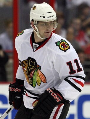 WASHINGTON DC, DC - SEPTEMBER 23:  John Madden #11 of the Chicago Blackhawks skates against the Washington Capitals during their preseason game on September 23, 2009 at the Verizon Center in Washington, DC.  (Photo by Jim McIsaac/Getty Images)