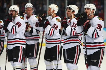 ZURICH, SWITZERLAND - SEPTEMBER 29: Dave Bolland (R) of Chicago looks on dejectedly with team mates after the 1-2 defeat during the ZSC Lions Zurich v Chicago Blackhawks Victoria Cup match at the Hallenstadion Arena on September 29, 2009 in Zurich, Switze