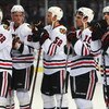 ZURICH, SWITZERLAND - SEPTEMBER 29: Dave Bolland (R) of Chicago looks on dejectedly with team mates after the 1-2 defeat during the ZSC Lions Zurich v Chicago Blackhawks Victoria Cup match at the Hallenstadion Arena on September 29, 2009 in Zurich, Switze