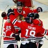 CHICAGO - MAY 24:  (L-R) Cam Barker #25, Patrick Sharp #10, Jonathan Toews #19 and Patrick Kane #88 of the Chicago Blackhawks celebrate after Toews scored a goal in the second period against the Detroit Red Wings during Game Four of the Western Conference