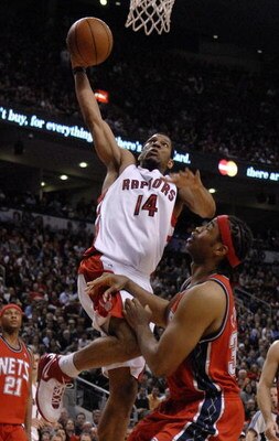 TORONTO- MAY 1:   Joey Graham #13 of the Toronto Raptors gets one up on Jason Collins #35 of the New Jersey Nets in Game Five of the Eastern Conference Quarterfinals during the 2007 NBA Playoffs at Air Canada Centre on May 1, 2007 in Toronto, Ontario, Can